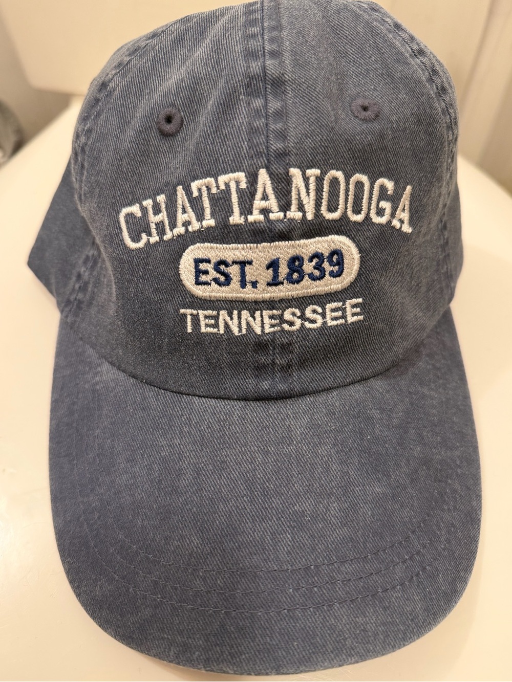 faded navy blue baseball cap